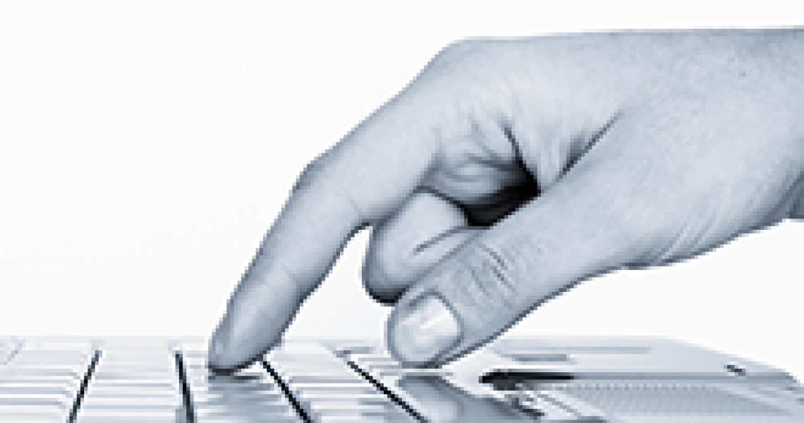 Woman typing on a computer